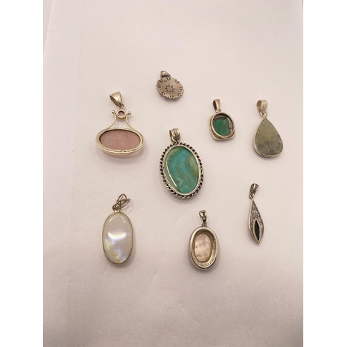 168 - A quantity of semi precious 925 silver pendants to include rose quartz, moonstone, marcasite and oth... 