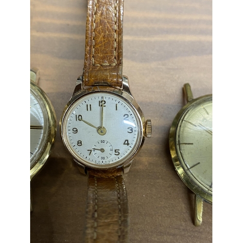 201 - A selection of wristwatches and watch faces, to include a vintage ladies wristwatch with silver mark... 