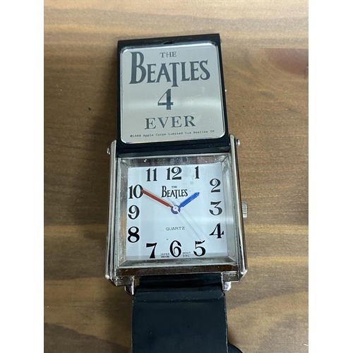 204 - A selection of wristwatches to include a watch with a flip cover of The Beatles 4 ever and a picture... 