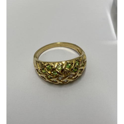 211 - Yellow gold peridot and diamond cluster ring, stamped 14k, approx size X/Y