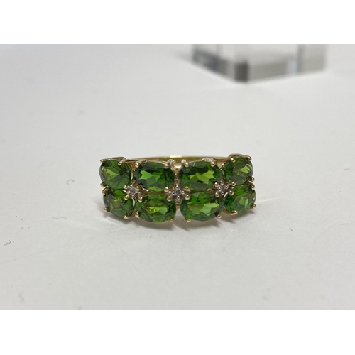 214 - 10ct yellow gold tourmaline and diamond ring in a double row stone set with  intermittent diamonds, ... 