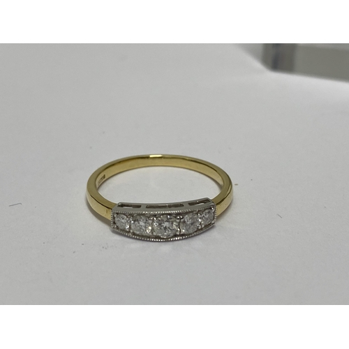 215 - 18ct yellow/white gold graduated five stone ring, approx size M, marked 750