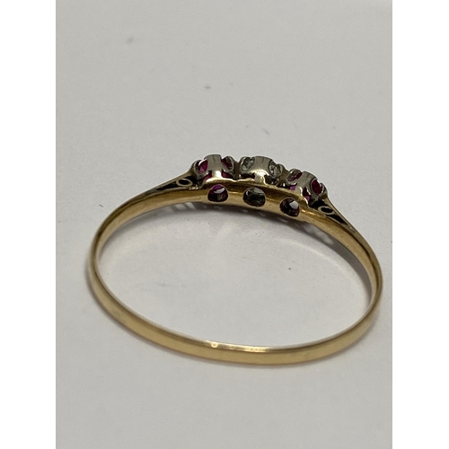 216 - Vintage 18ct yellow gold three stone diamond and ruby ring, approx size R, unmarked, central diamond... 