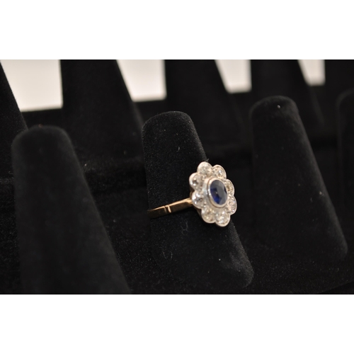 180 - Antique yellow gold cluster ring. with eight rose cut diamonds surrounding central oval sapphire sto... 