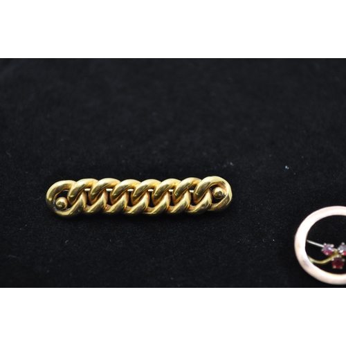 114 - A 15ct gold Brooch with an interlinking rope pattern approx. weight 5g together with brooch of circu... 