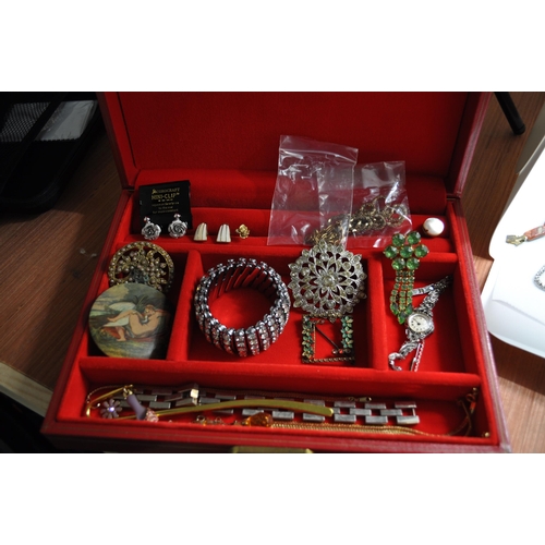 128 - Two boxes of costume jewellery to include an iridescent dragonfly brooch, rings, two sets of screw b... 