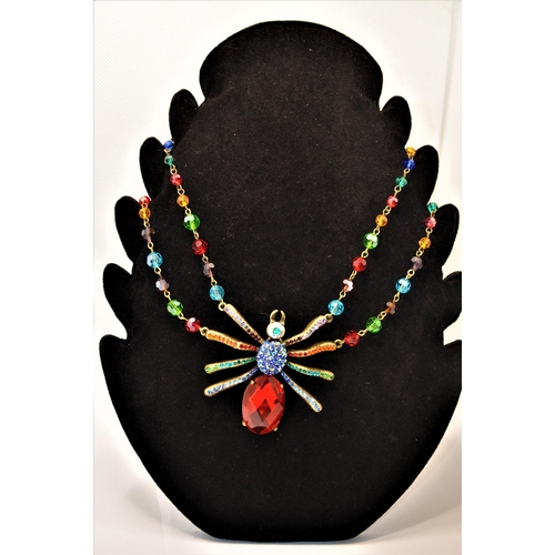 136 - A Butler and Wilson large rainbow / multicoloured spider necklace (approx. size of spider l 7cm x w ... 