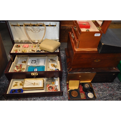 138 - Two jewellery boxes with contents to include silver ring, gold hoop earrings, with badges and brooch... 