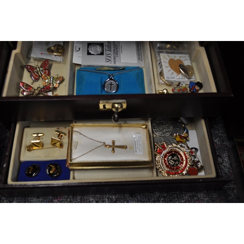 138 - Two jewellery boxes with contents to include silver ring, gold hoop earrings, with badges and brooch... 