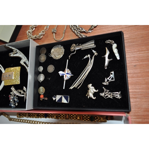 140 - A quantity of jewellery items to include cuff links, necklaces, bracelets, pin brooches etc. contain... 