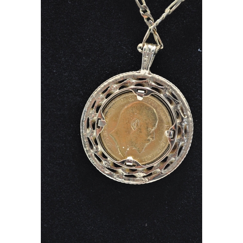 160 - A 1909 Edward VII gold sovereign mounted in 9ct gold coin pendant holder together with 9ct gold neck... 