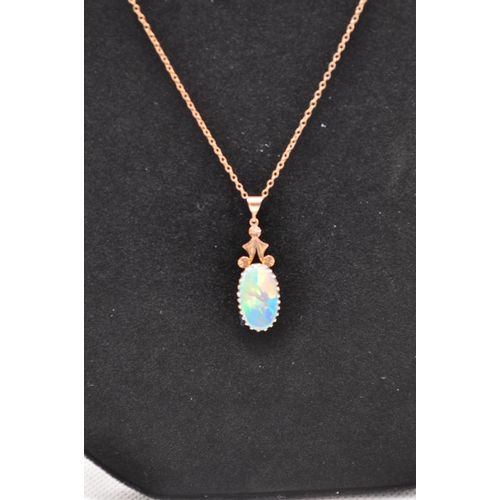 161 - A 9ct gold necklace with an opal pendant (unmarked tests 9ct)