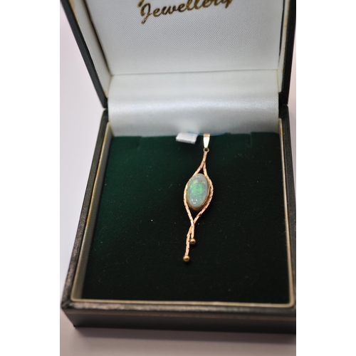 163 - Opal and gold pendant hallmarked 375 together with a Garnet, amethyst, smoked quartz drop pendant ma... 