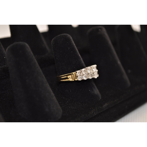 179 - An 18ct yellow gold ring, featuring a double row of approx. 1.15ct graduated diamonds on a step gall... 