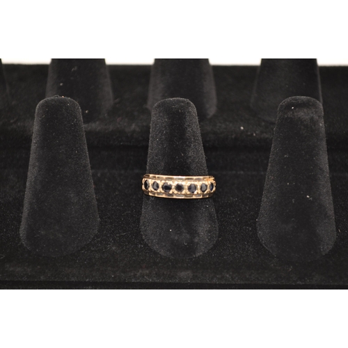 182 - Antique 9ct gold ring half eternity design with seven dark sapphire stones, approx. size O, approx. ... 