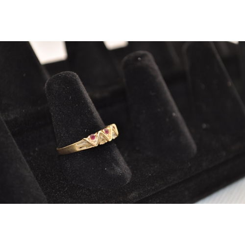 185 - Yellow gold ring stamped 585 with zig zag alternate diamond and ruby design Size O, approx. 1.75g