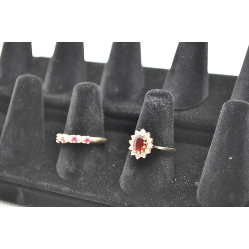 186 - X2 RINGS -  9ct yellow gold rings with one with ruby and diamond and the other with a central garnet... 