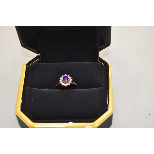 186 - X2 RINGS -  9ct yellow gold rings with one with ruby and diamond and the other with a central garnet... 