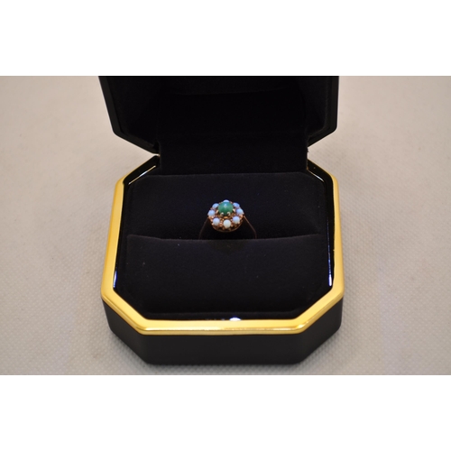 187 - 9ct gold ring with inset likely green turquoise stone with surrounding opals, approx size L