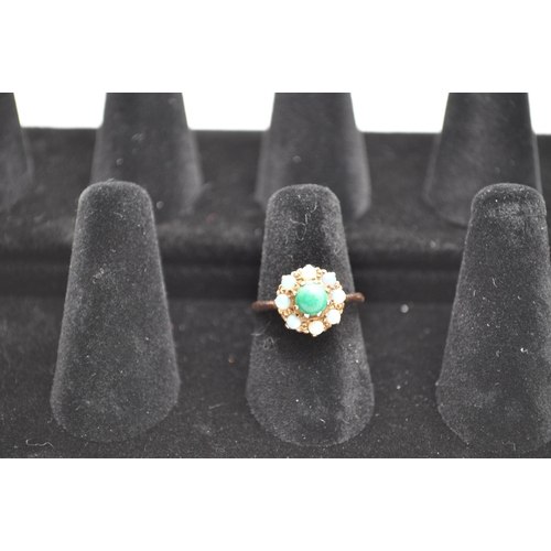 187 - 9ct gold ring with inset likely green turquoise stone with surrounding opals, approx size L