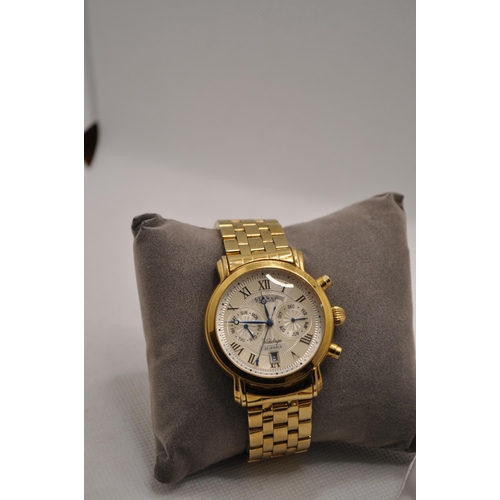 224 - A gold coloured Stauer automatic watch with royal blue hands with 3 subsidiary dials, marked 27 jewe... 