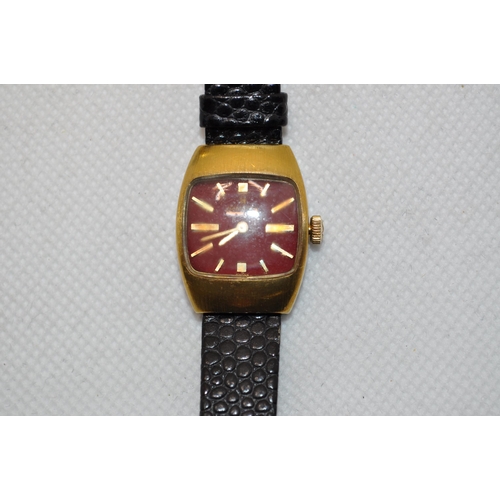 224 - A gold coloured Stauer automatic watch with royal blue hands with 3 subsidiary dials, marked 27 jewe... 