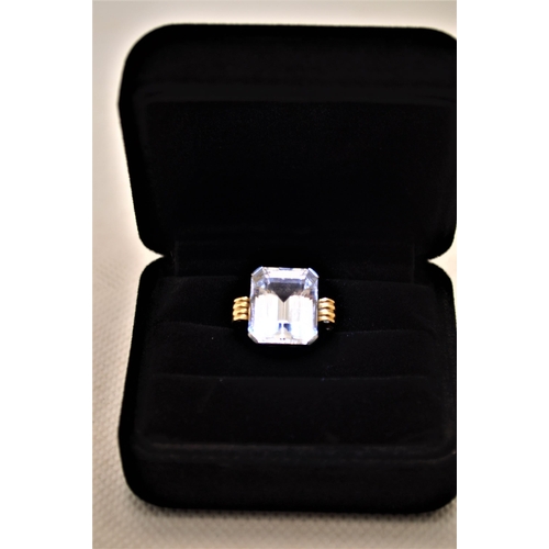 238 - A 18ct yellow gold and platinum spectacular cocktail ring with rectangular faceted white sapphire st... 