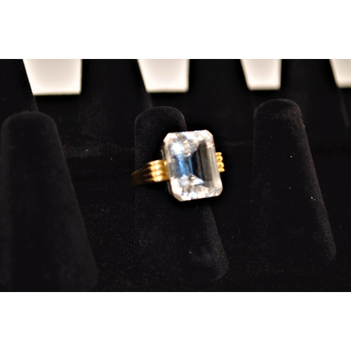 238 - A 18ct yellow gold and platinum spectacular cocktail ring with rectangular faceted white sapphire st... 