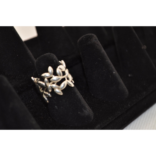 239 - Tiffany &co olive leaf band foliate style silver ring marked Tiffany 925, with original receipt, pou... 