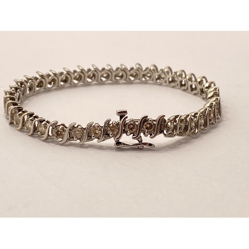 104 - Diamond bracelet in excess of 2cts