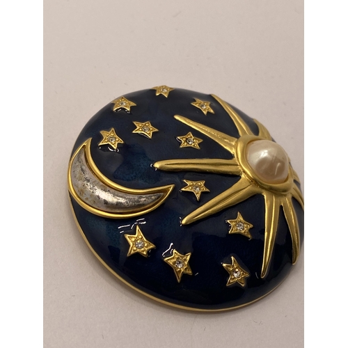 116 - Sun, Moon, and Stars gold tone brooch marked with KL monogram (Karl Lagerfeld)