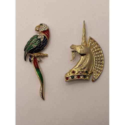 117 - Butler and Wilson diamante red /green stone unicorn together with an Attwood and Sawyer Brooch in th... 