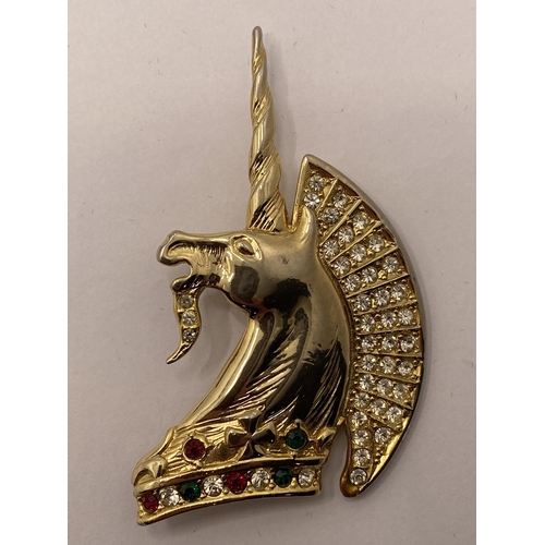 117 - Butler and Wilson diamante red /green stone unicorn together with an Attwood and Sawyer Brooch in th... 