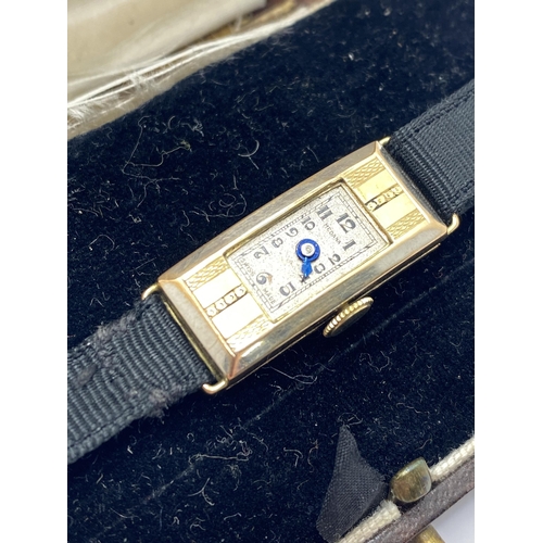 202 - Two ladies wristwatches to include one watch marked 9ct gold, A5M1428 to back of case with fabric st... 