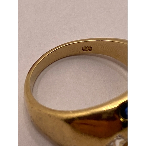 24 - A yellow gold ring, marked 09 with blue and clear stones approx. size R, approx. weight 4.7g