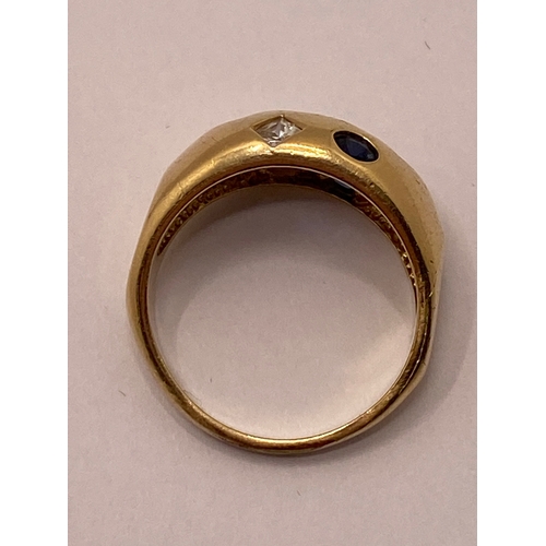 24 - A yellow gold ring, marked 09 with blue and clear stones approx. size R, approx. weight 4.7g