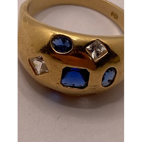 24 - A yellow gold ring, marked 09 with blue and clear stones approx. size R, approx. weight 4.7g