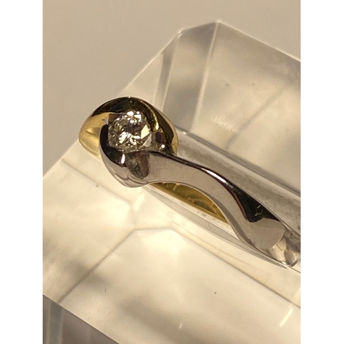 219 - 18ct yellow/white gold single stone diamond ring of approx  .20ct, stamped 750, approx size O