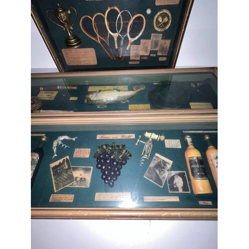 125 - A selection of four boxed display cabinets with items such as wines, fishing, golf, motorcycling etc... 