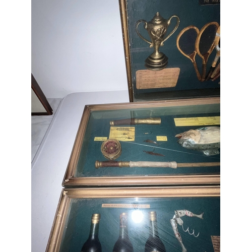 125 - A selection of four boxed display cabinets with items such as wines, fishing, golf, motorcycling etc... 