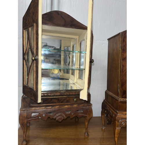 130 - Hand carved walnut miniature glazed display cabinet with mirror back and bottom, with x2 glass shelv... 