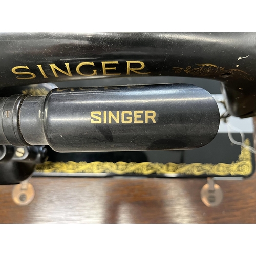 15 - Singer sewing machine serial no Y9496305, model no.66 with BRK electric motor on Singer table (model... 