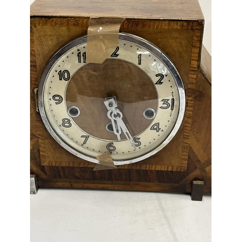 251 - Art deco inspired mantle clock marked foreign to front with one other clock together with a vintage ... 