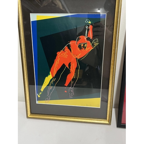 273 - Two framed prints of male form, one featuring speed skater by Andy Warhol