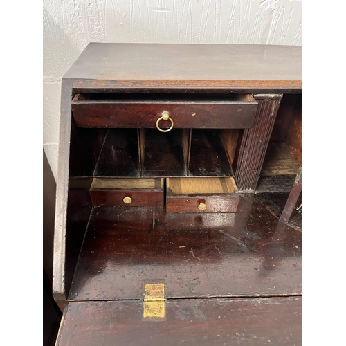 43 - Antique oak bureau, the fall front opening to reveal an interior arrangement of drawers and pull-dow... 