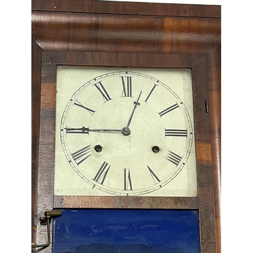 56 - An American wall clock by the Chauncey Jerome with glazed panel to front depicting a country house s... 