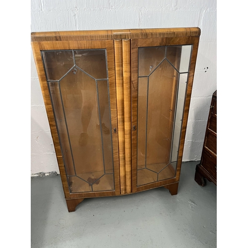 63 - Vintage walnut veneered cabinet with leaded glass panels and glass shelving, with key. Approx H130cm... 