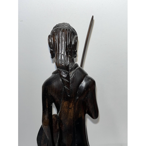 64 - Ebonised wooden figure of an African warrior together with x3 prints from different artists depictin... 