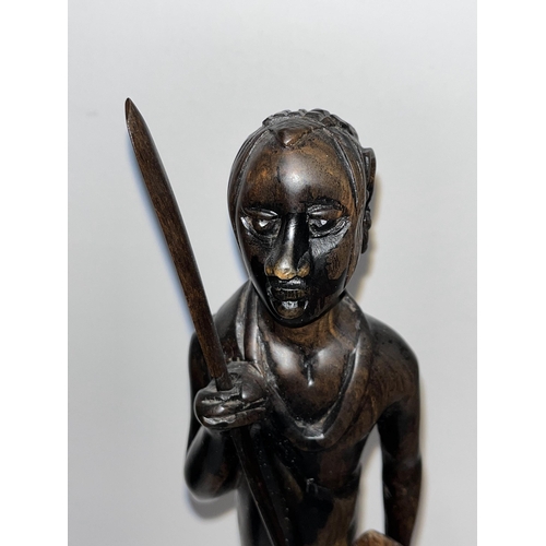 64 - Ebonised wooden figure of an African warrior together with x3 prints from different artists depictin... 