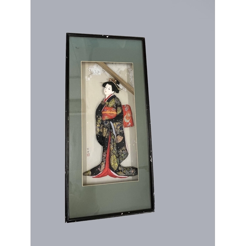 69 - A pair of oriental framed silks depicting landscape scenes alongside a framed 3D silk of a lady